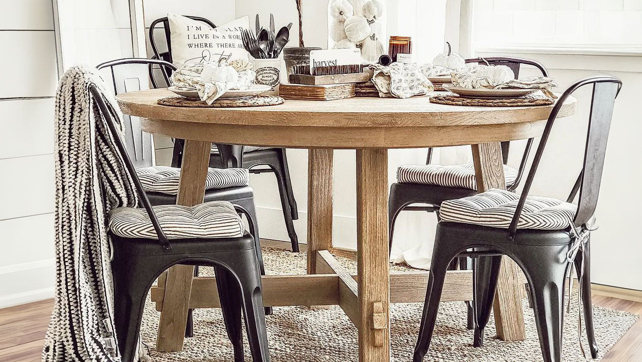 metal chair cushions on tolix chairs in a farmhouse dining room with industrial decor