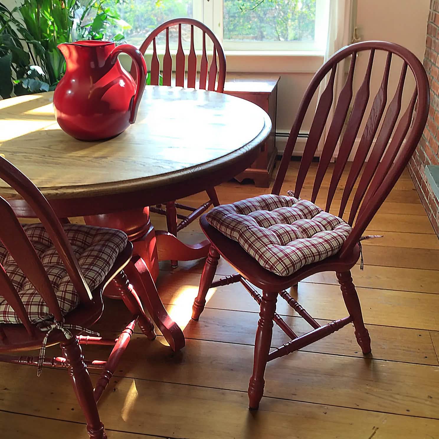 Close-up view of Montgomery Red plaid dining chair cushions showing detailed fabric texture and pattern