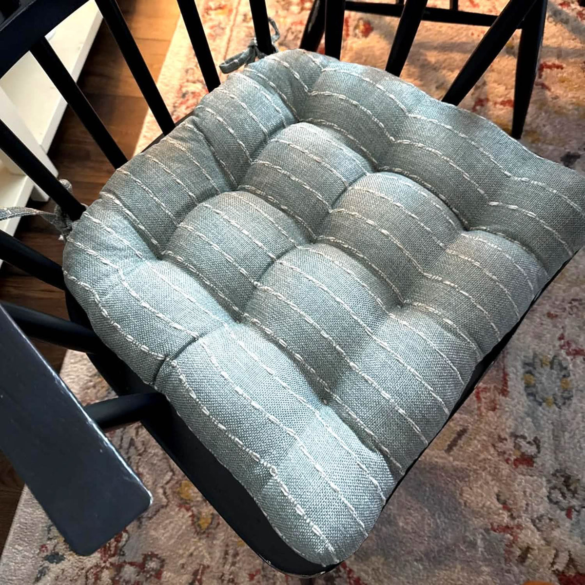 Close up of avante spa dining chair cushion on black chair.