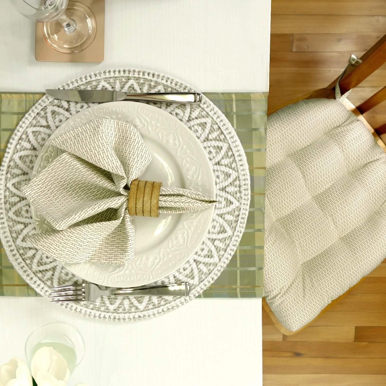 Close up of Basketweave Dove Dining chair pad and napkin