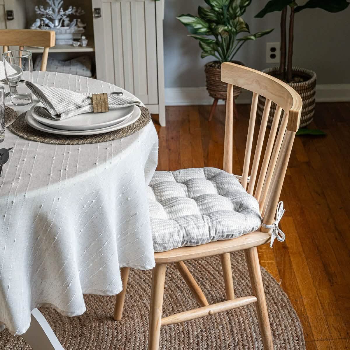 Basketweave dove gray dining chair pad on wooden chair