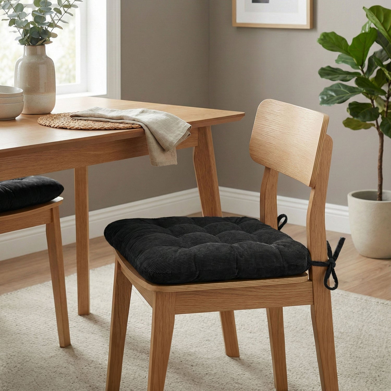 black corduroy dining chair cushions in contemporary scan design dining room