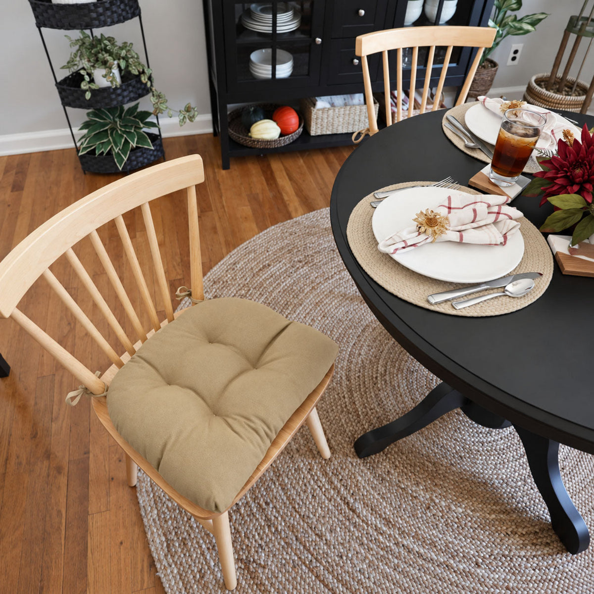 tan dining chair pad in a dining room decorated for fall