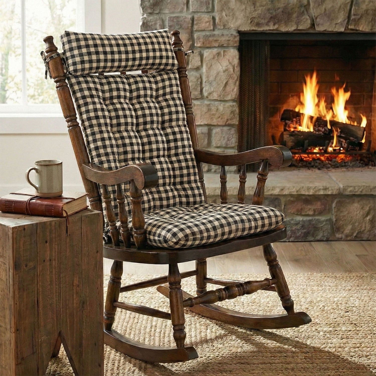 Wooden rocking chair with checkered cushion in front of a fireplace