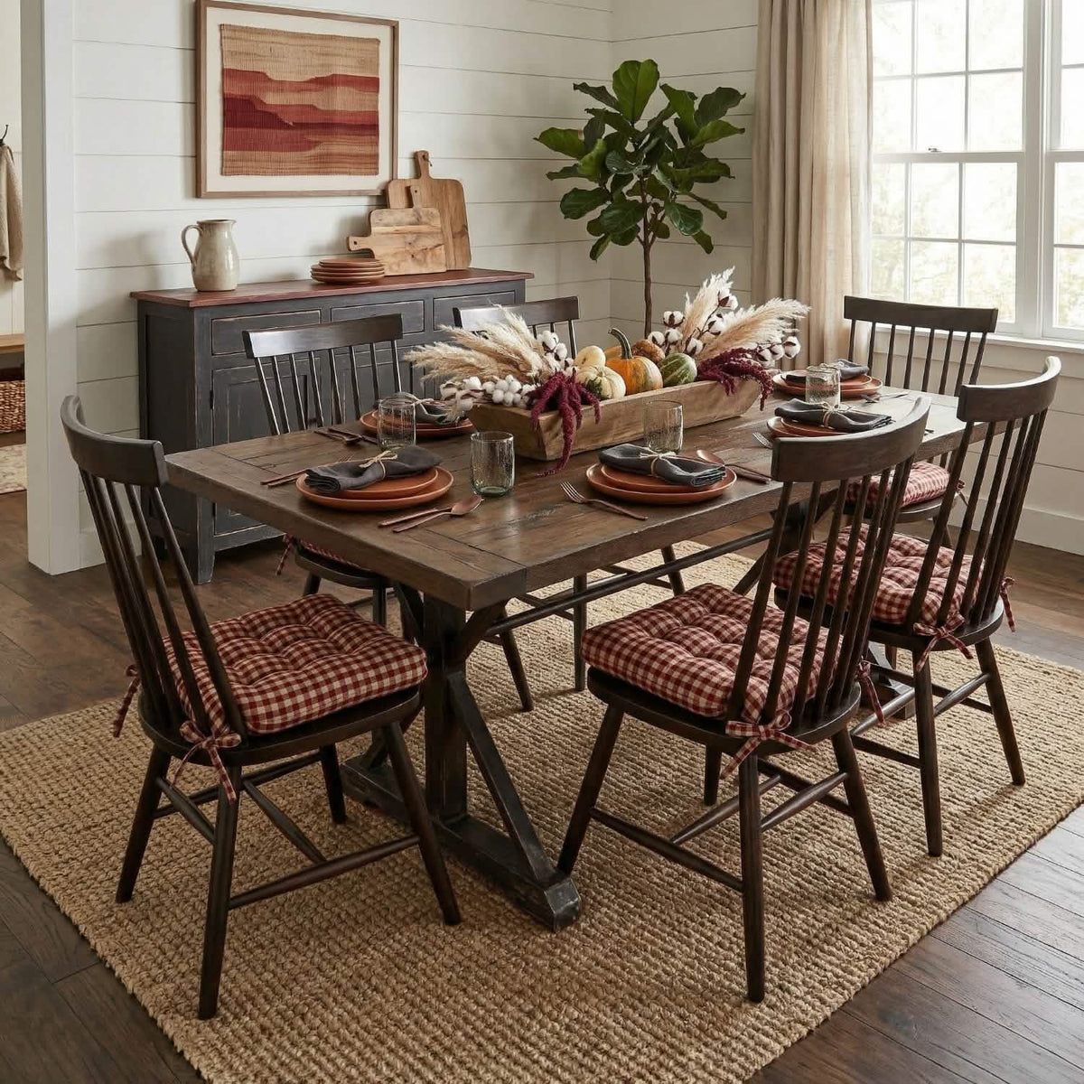 red and tan checkered dining chair cushions in dining room with black dining chairs