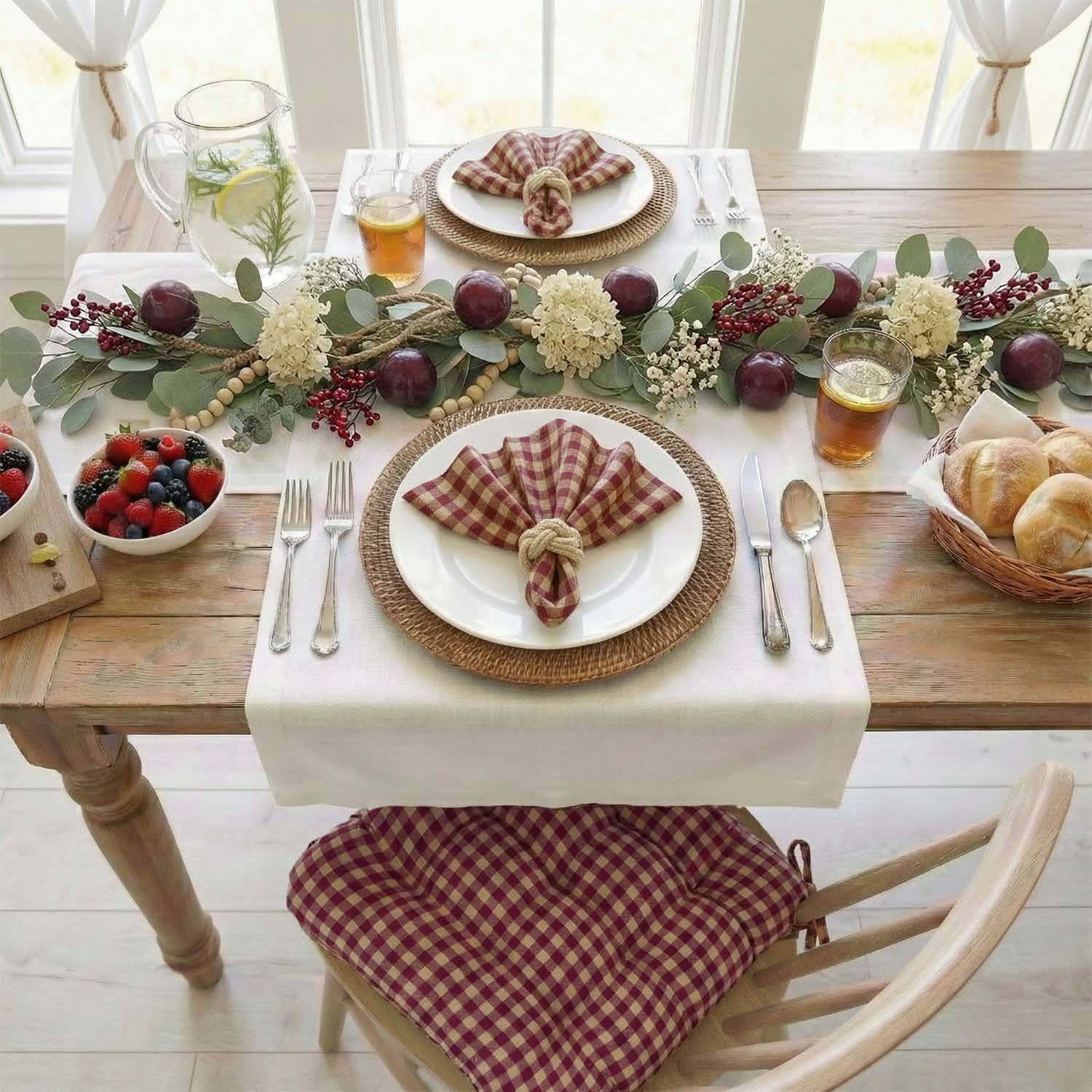 dining table set with red checkered dining chair cushions and matching cloth napkins