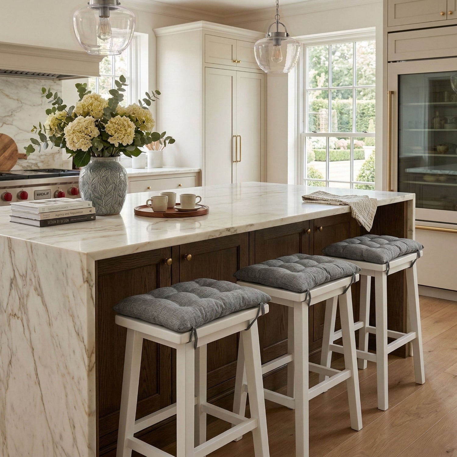 grey saddle stools cushions at kitchen island in contemporary breakfast bar