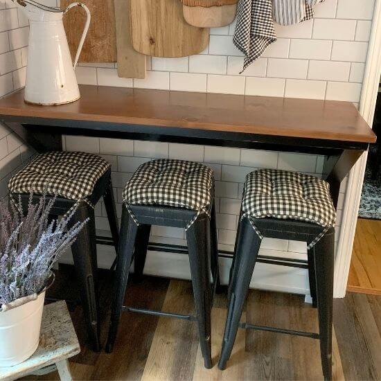 square bar stool cushions on industrial tolix stools in farmhouse kitchen