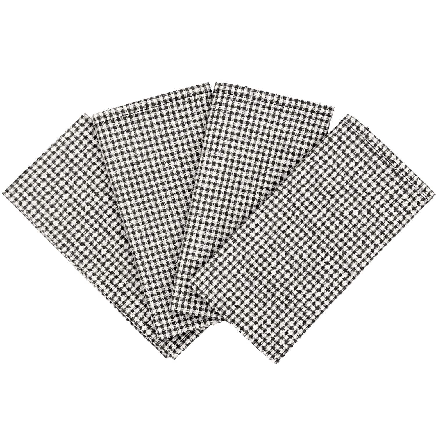 Four black and white checkered napkins on a white background