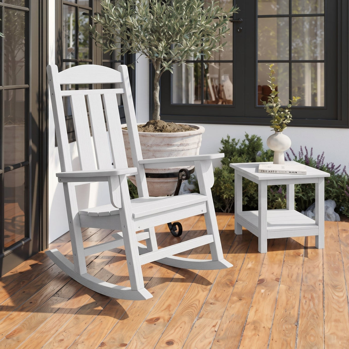 White outdoor rocking chair on a wooden deck