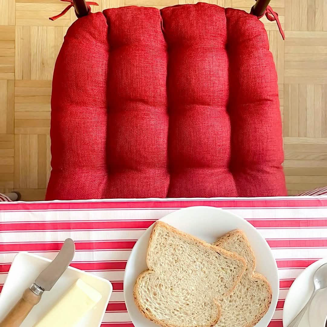 Close up of rave red dining chair pad showing texture.