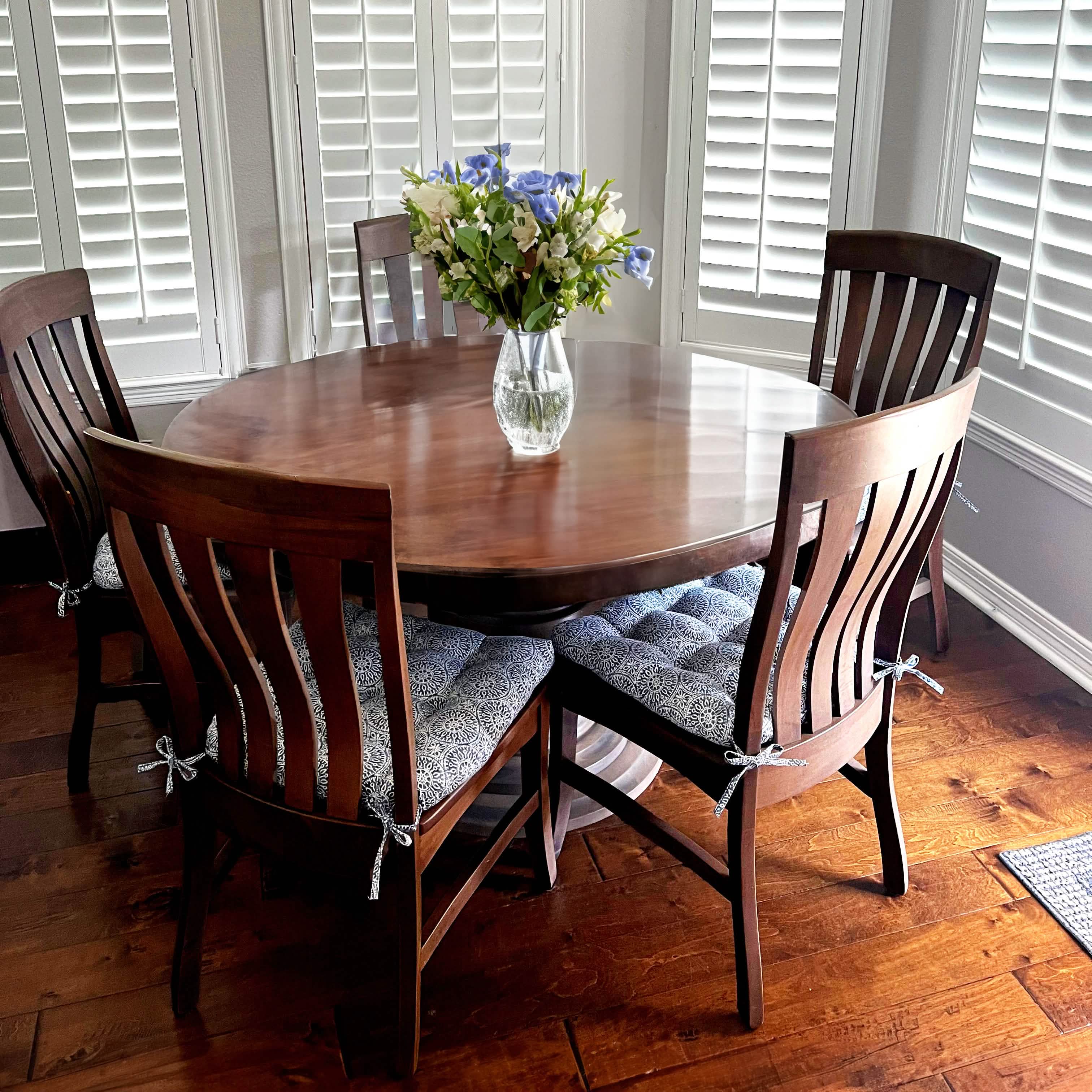 Close-up view of Tibet Blue dining chair cushions showing detailed mandala pattern and fabric texture