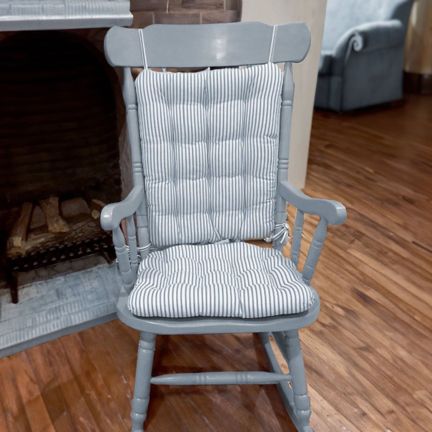 light blue ticking stripe rocker cushions on a colonial blue rocking chair in a traditional living room