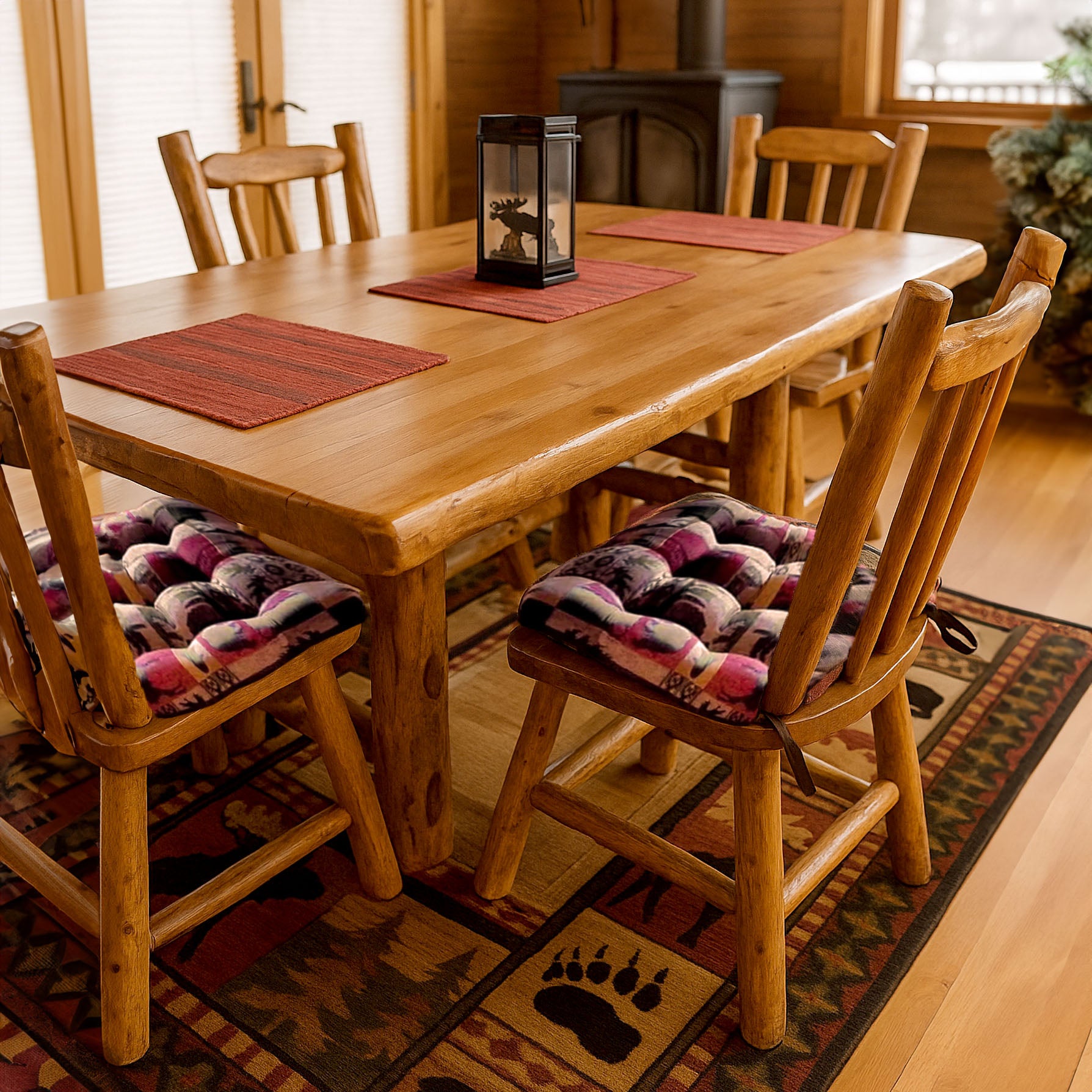 Close-up detail view of Woodlands Fairbanks dining chair cushion showing wildlife pattern