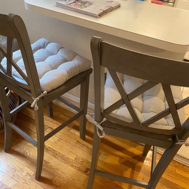 Madrid grey gingham dining chair cushion placed on wooden chair showing proper fit and tie placement