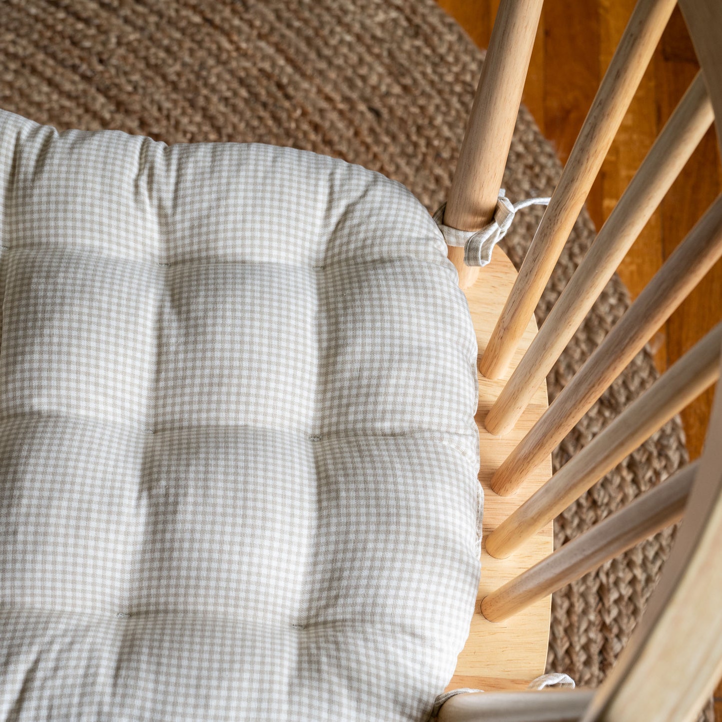 closeup of gingham checked chair pad in natural cotton