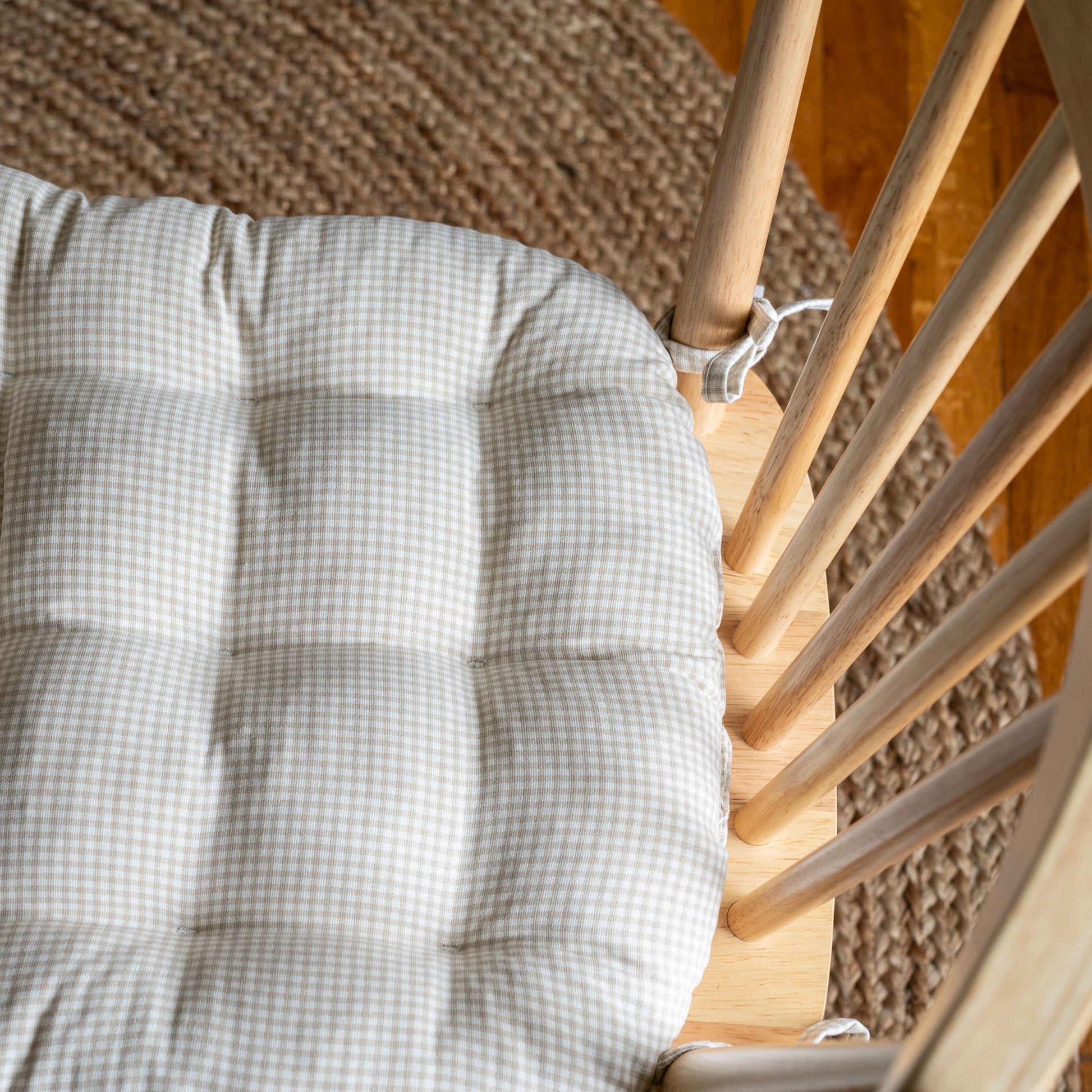 closeup of gingham checked chair pad in natural cotton