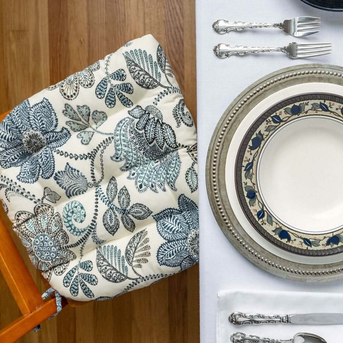 formal dining room chair cushions in blue floral with pewter charger