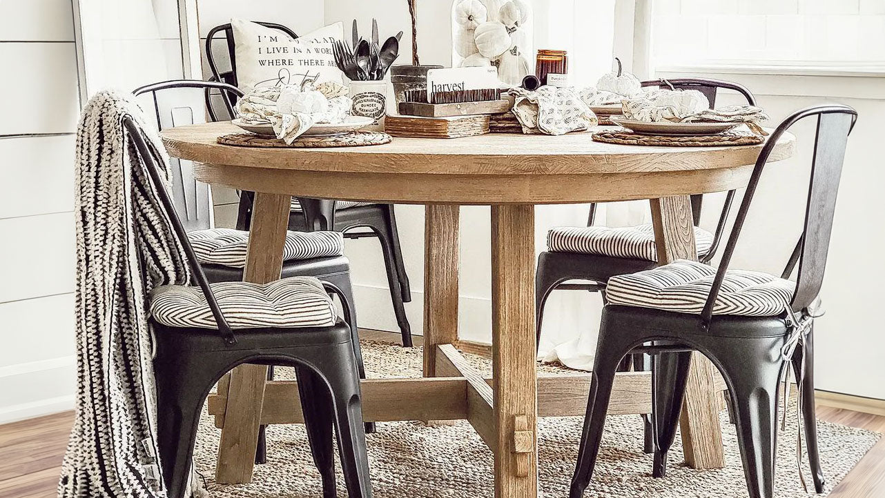 metal chair cushions on tolix chairs in a farmhouse dining room with industrial decor