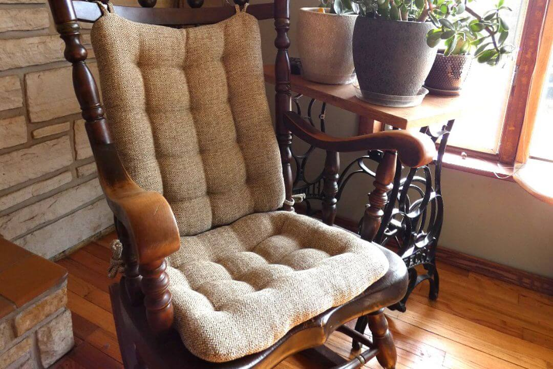 neutral colored rocking chair cushions on a wooden rocking chair in the living room