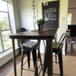 black ticking stripe tolix stool cushions at a bar height cafe table