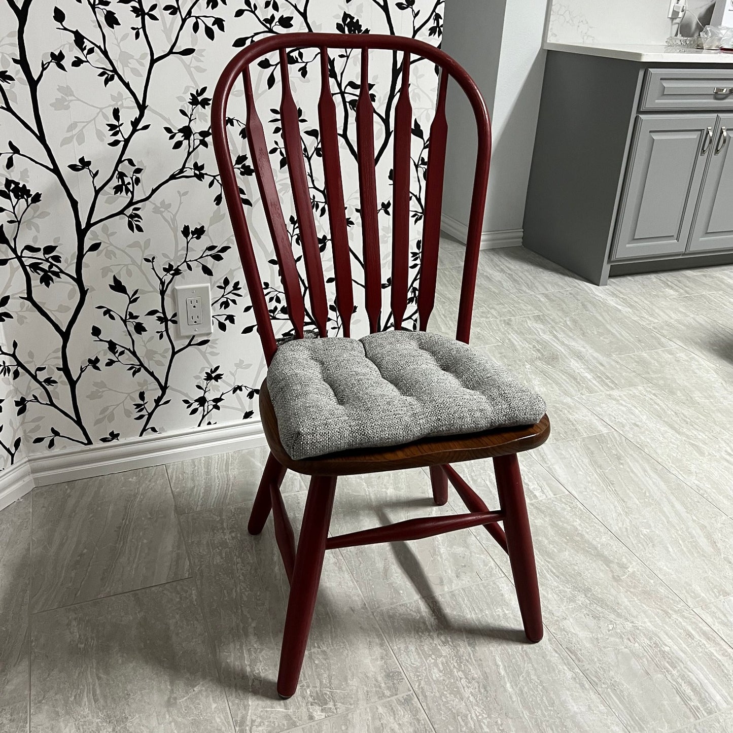 gray dining chair cushion on a windsor chair in a grey kitchen