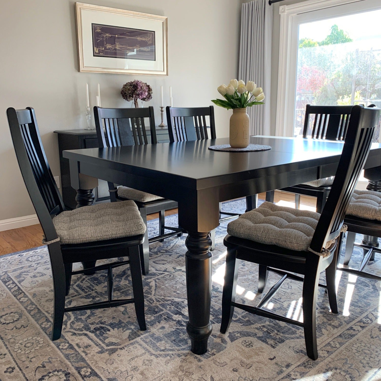 gray tweed dining chair cushions on black dining chairs in formal dining room