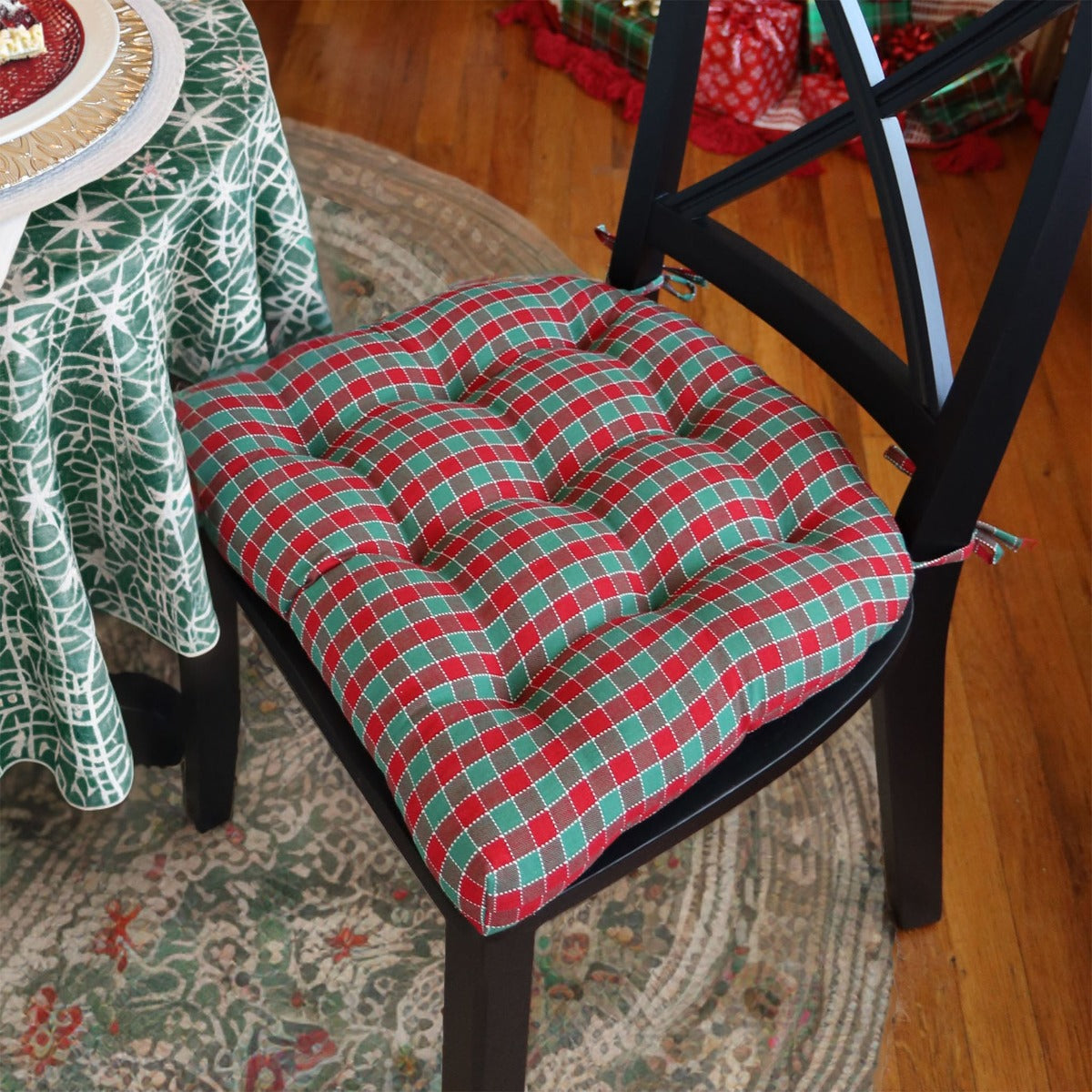 red and green plaid dining chair cushions in dining room decorated for christmas as seen in vermont country store