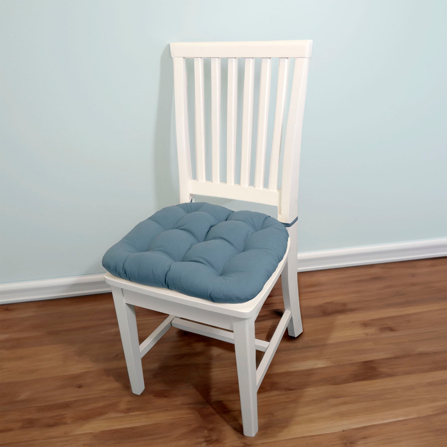 federal blue dining chair cushion on a white dining room chair
