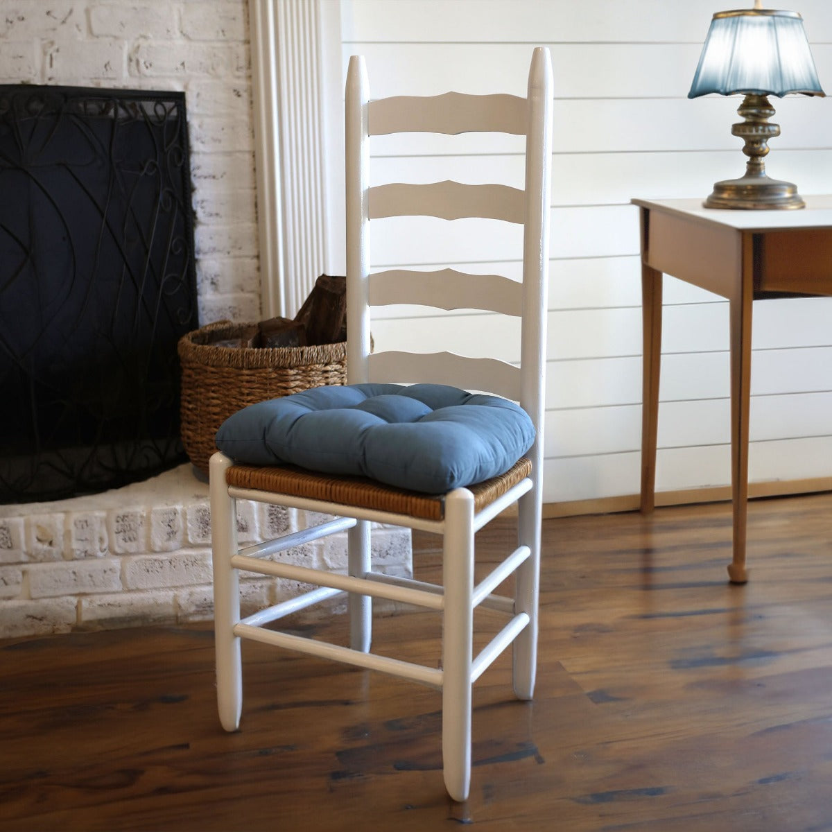 federal blue chair pad on ladderback dining chair with cane seat in farmhouse dining room with shiplap