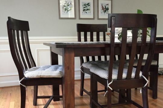 dining chair pads on dining room chairs in formal dining room at barnett home decor
