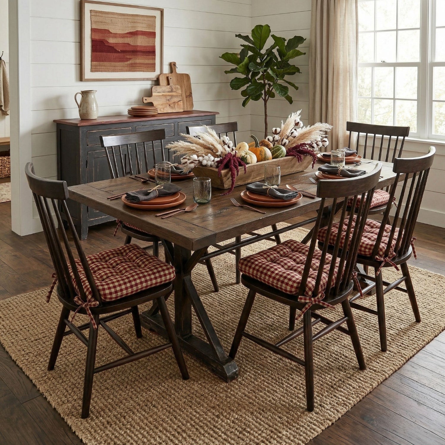 red and tan checkered dining chair cushions in dining room with black dining chairs