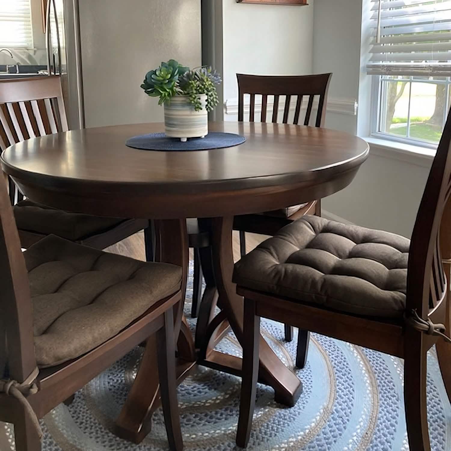 Close-up view of Hayden Mink dining chair cushions showing texture and reversible design