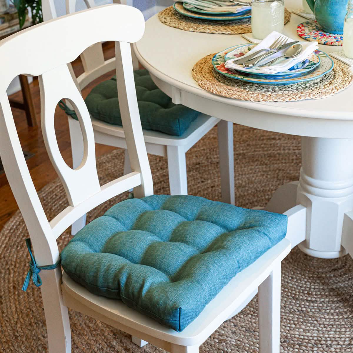Hayden turquoise dining chair pads with latex foam fill and ties on wooden chair