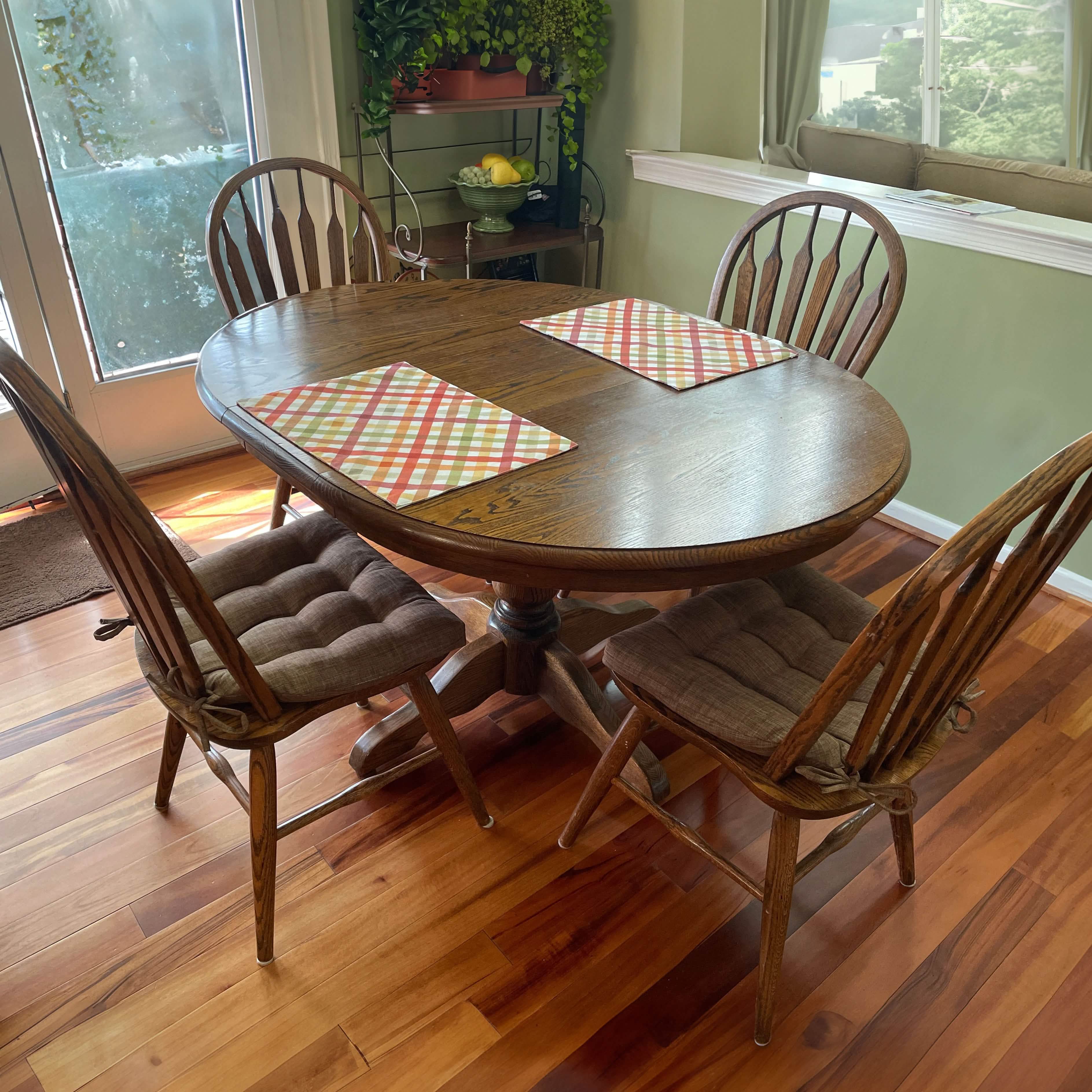 Close-up view of Hayden Pecan chair pad showing tufted design and tie attachments