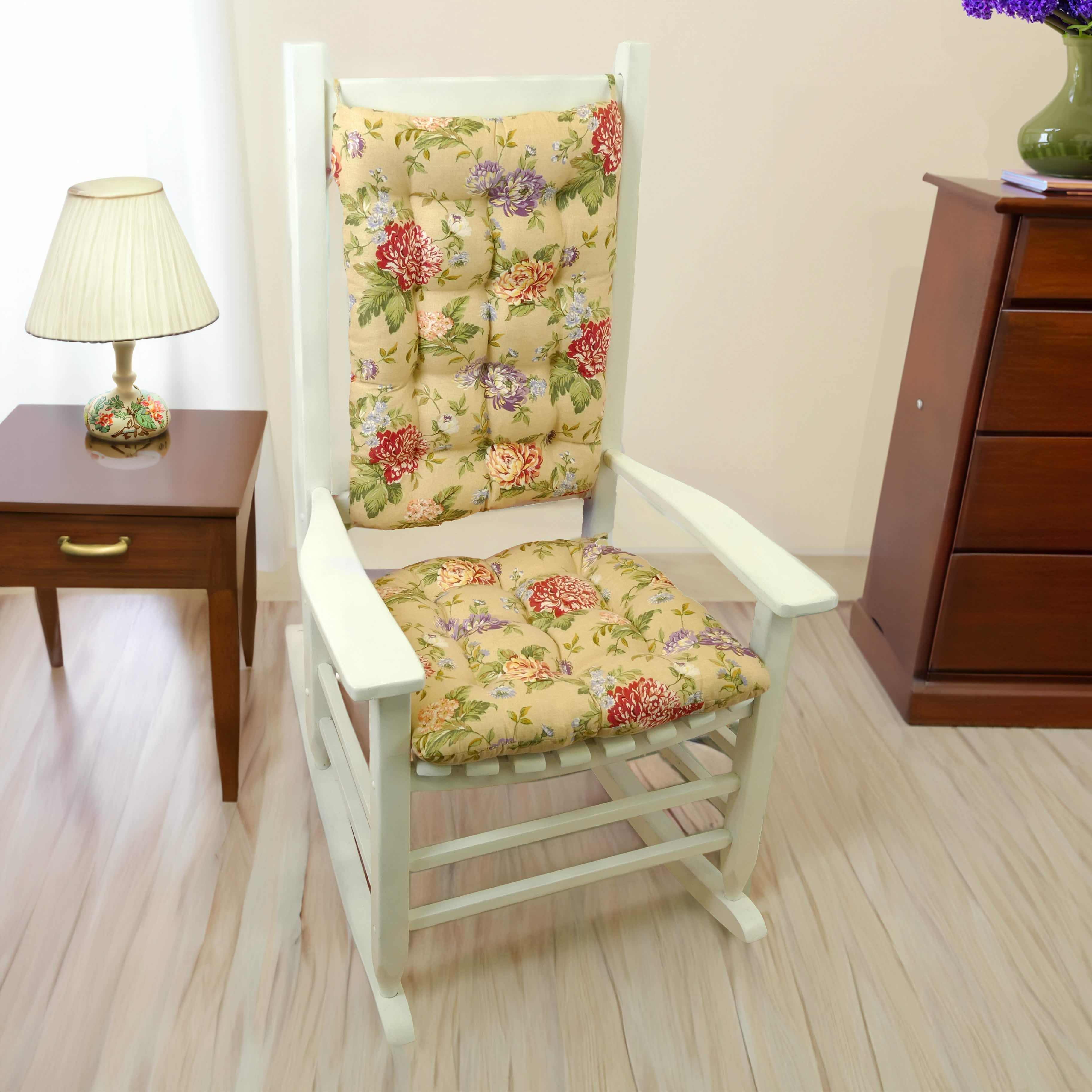 floral rocking chair cushions with red flowers and purple flowers on a neutral background