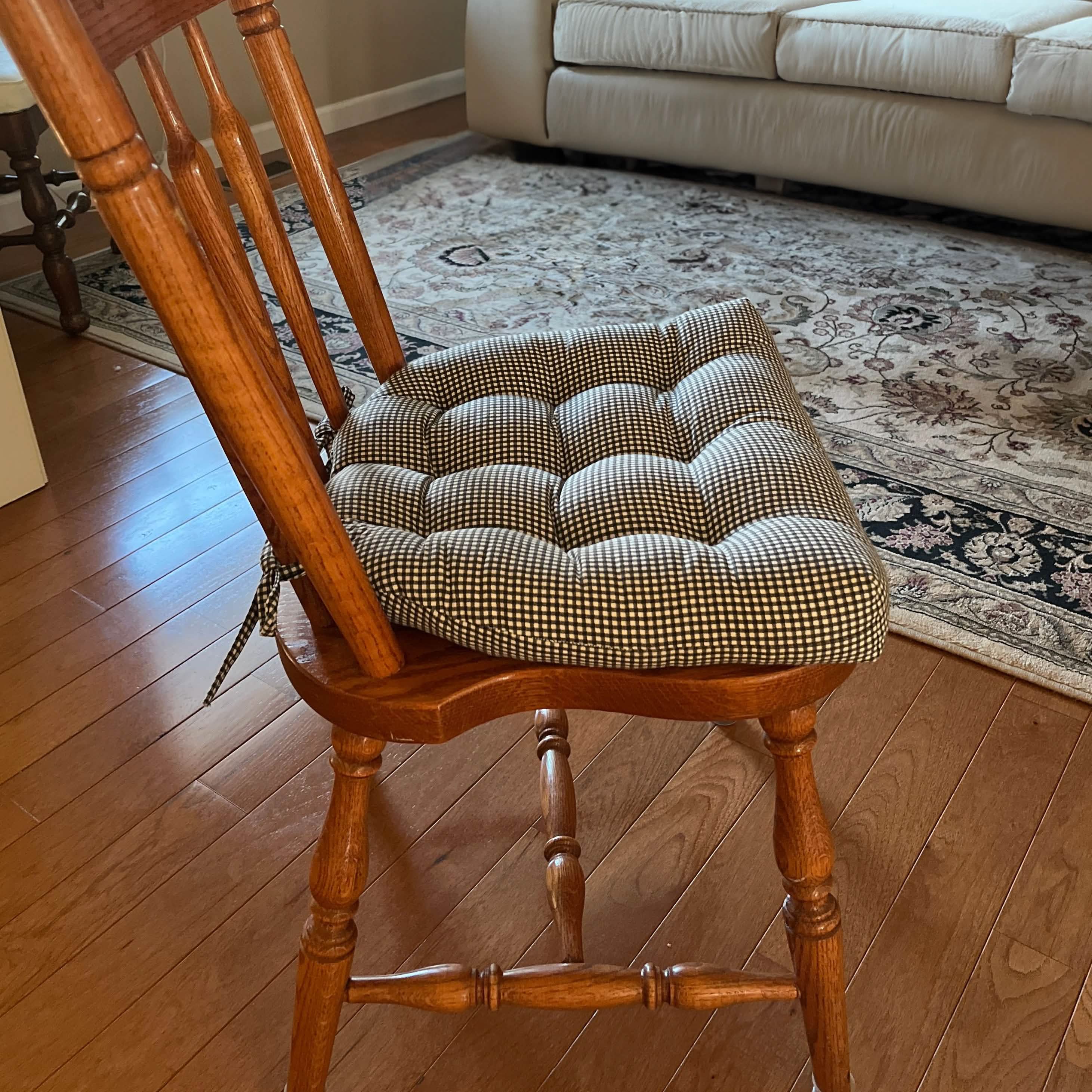 Madrid Black Gingham dining chair cushions from Barnett Home Decor's Americana Collection displayed on wooden chairs
