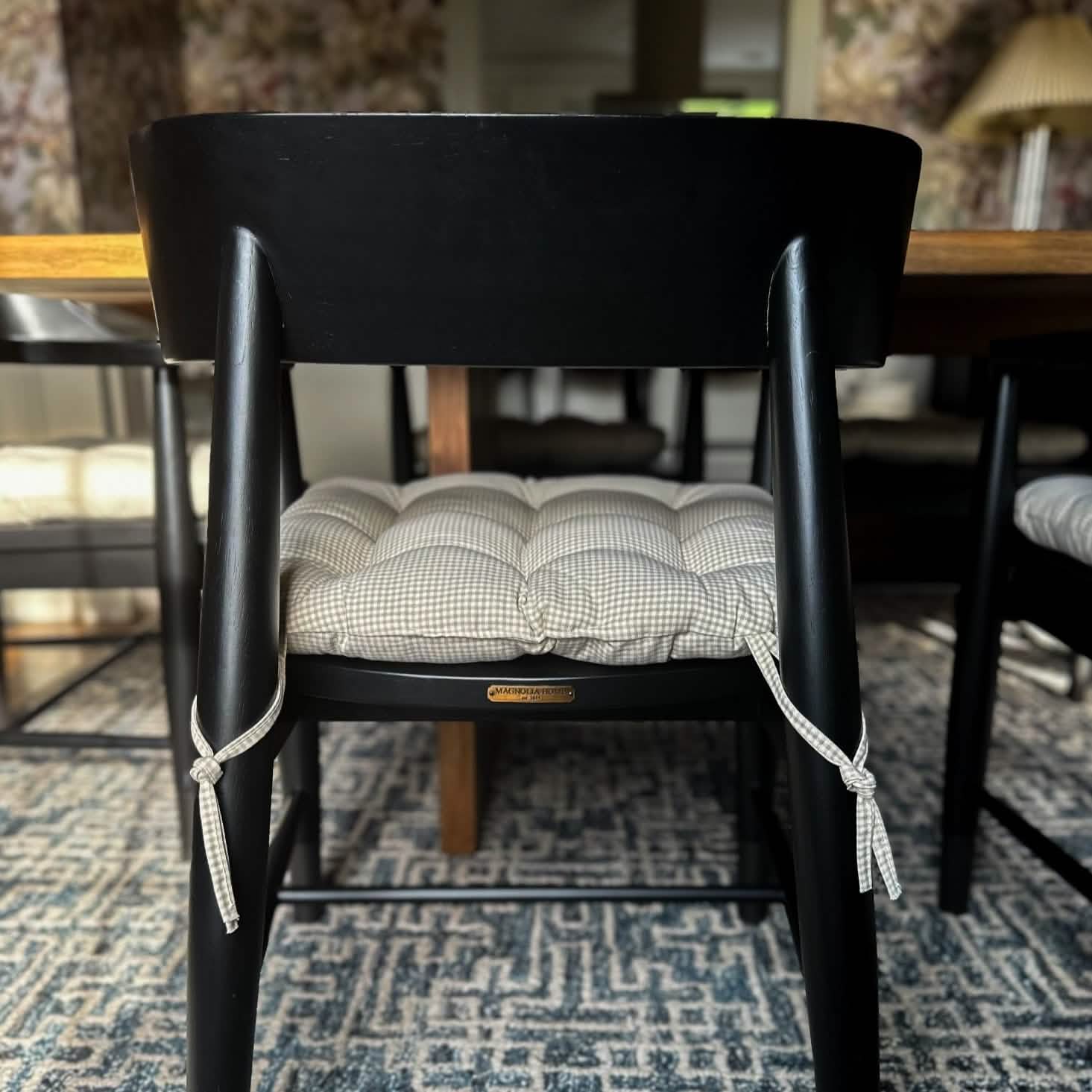 neutral gingham dining chair cushions in a transitional dining room styled by kate duval