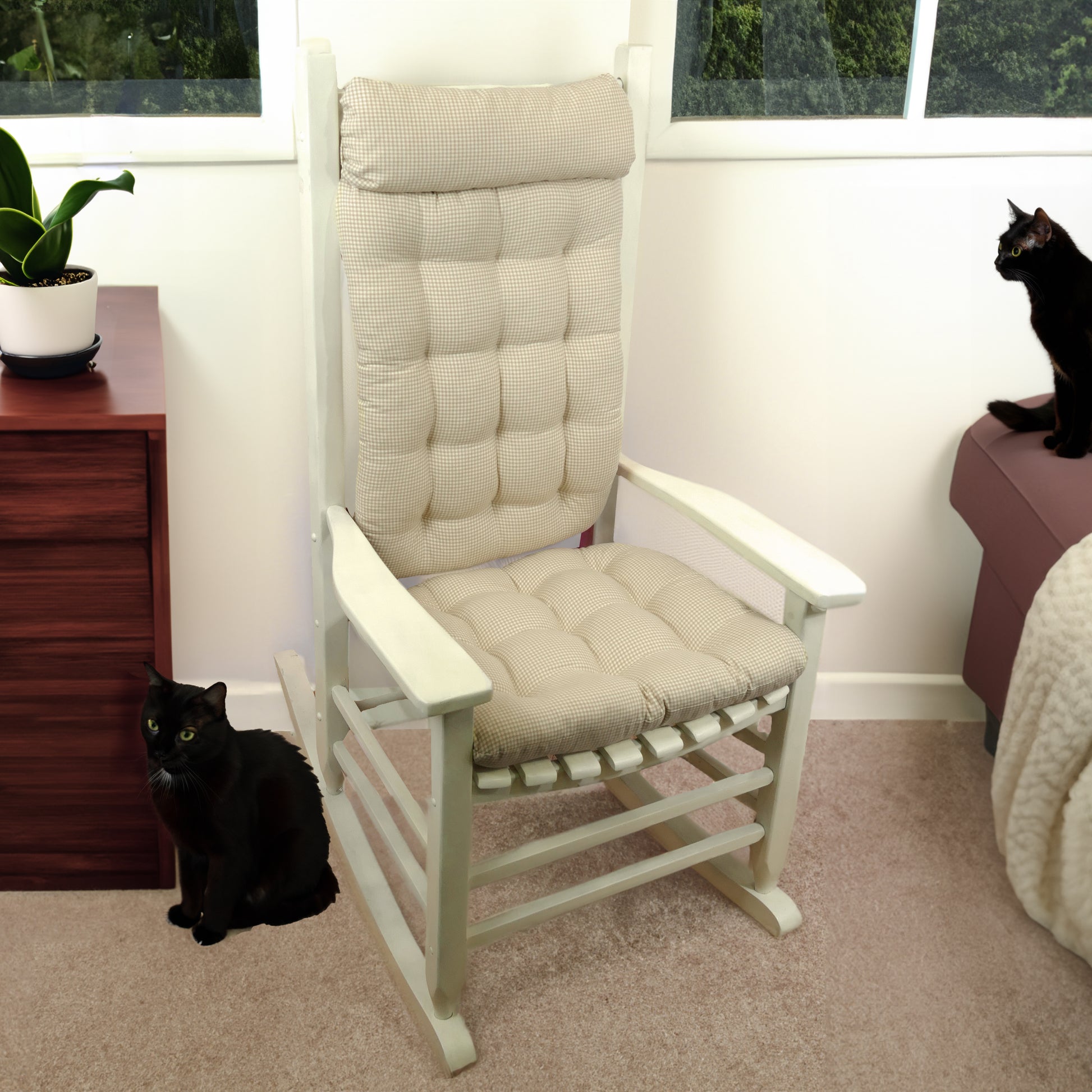 neutral colored rocking chair cushions on a white rocker with cats