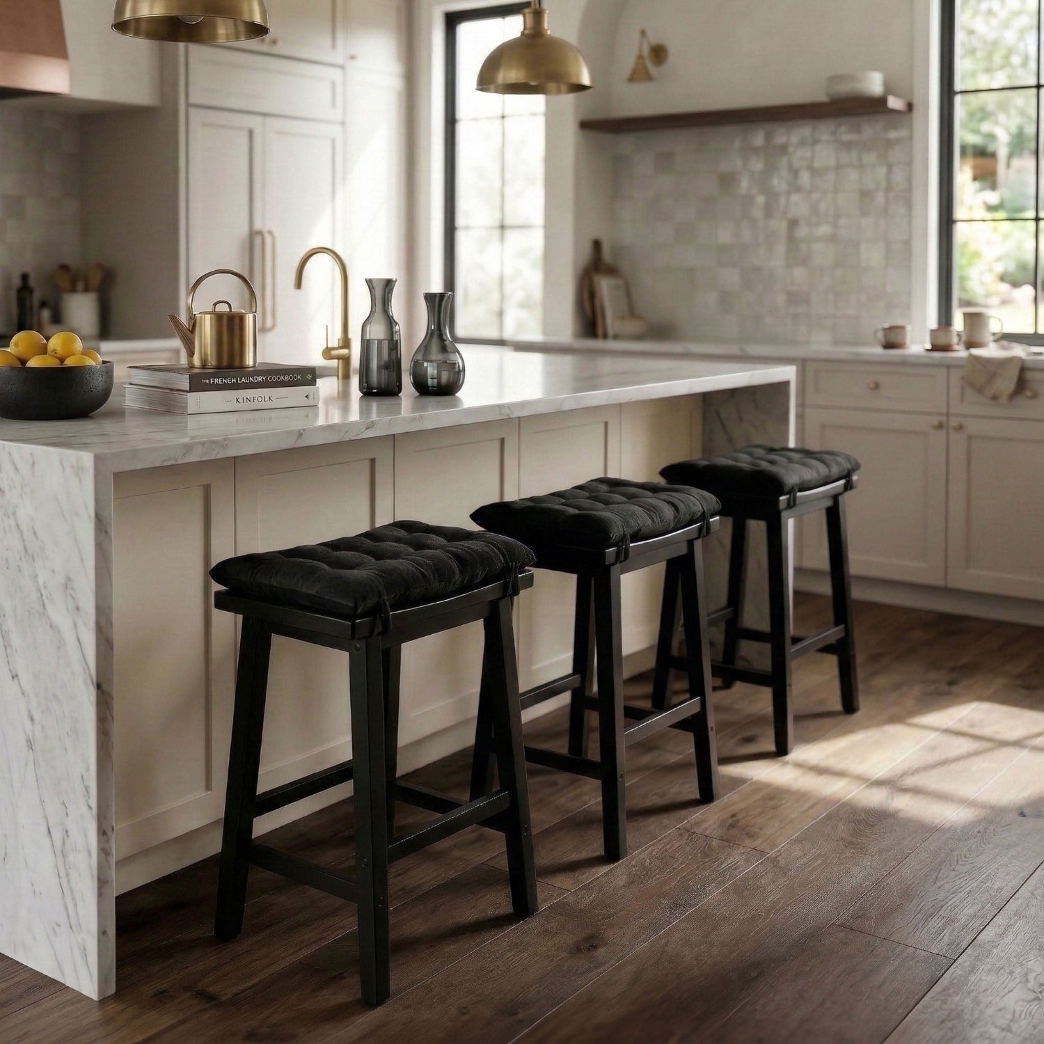 saddle stools with cushions in chef's kitchen