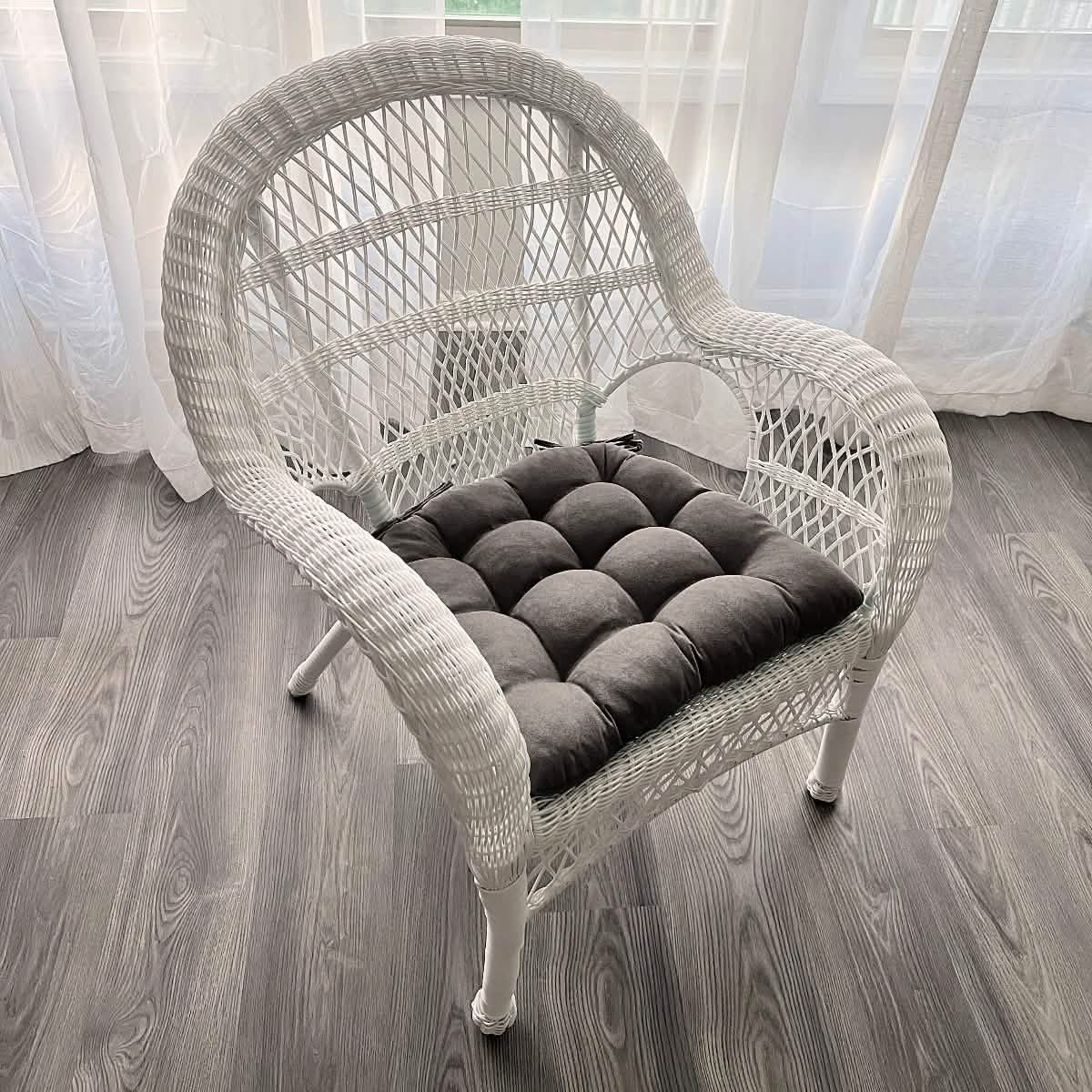 Grey microsuede chair cushions on wicker dining chairs showing versatile styling options