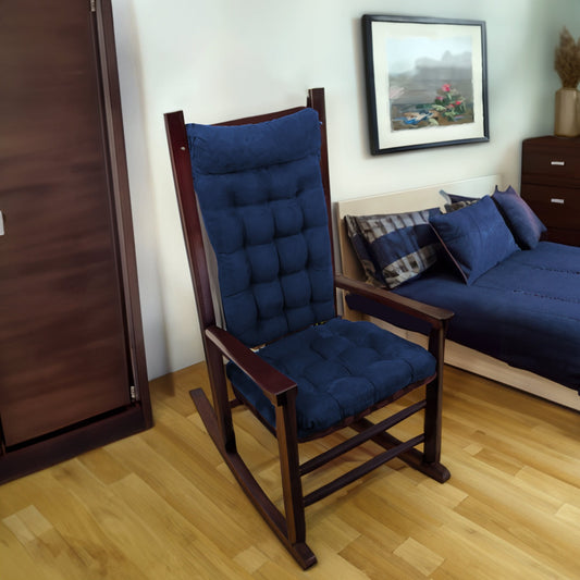 blue rocker cushions on a wooden rocking chair in a contemporary guest bedroom