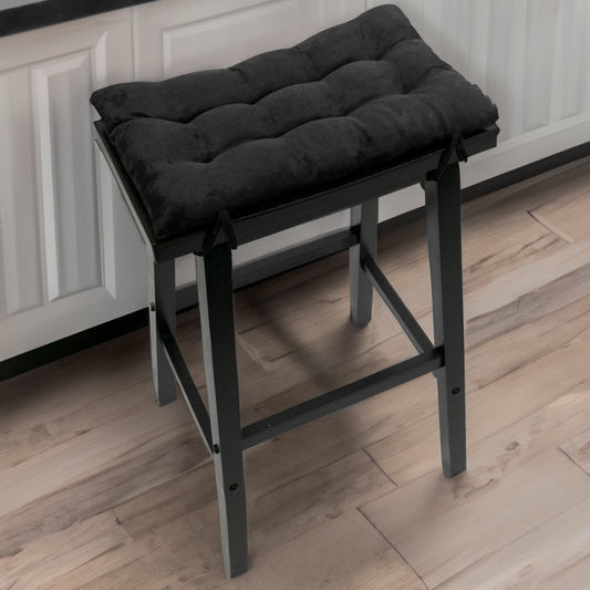 black saddle stool cushions with black quarts countertop on kitchen island