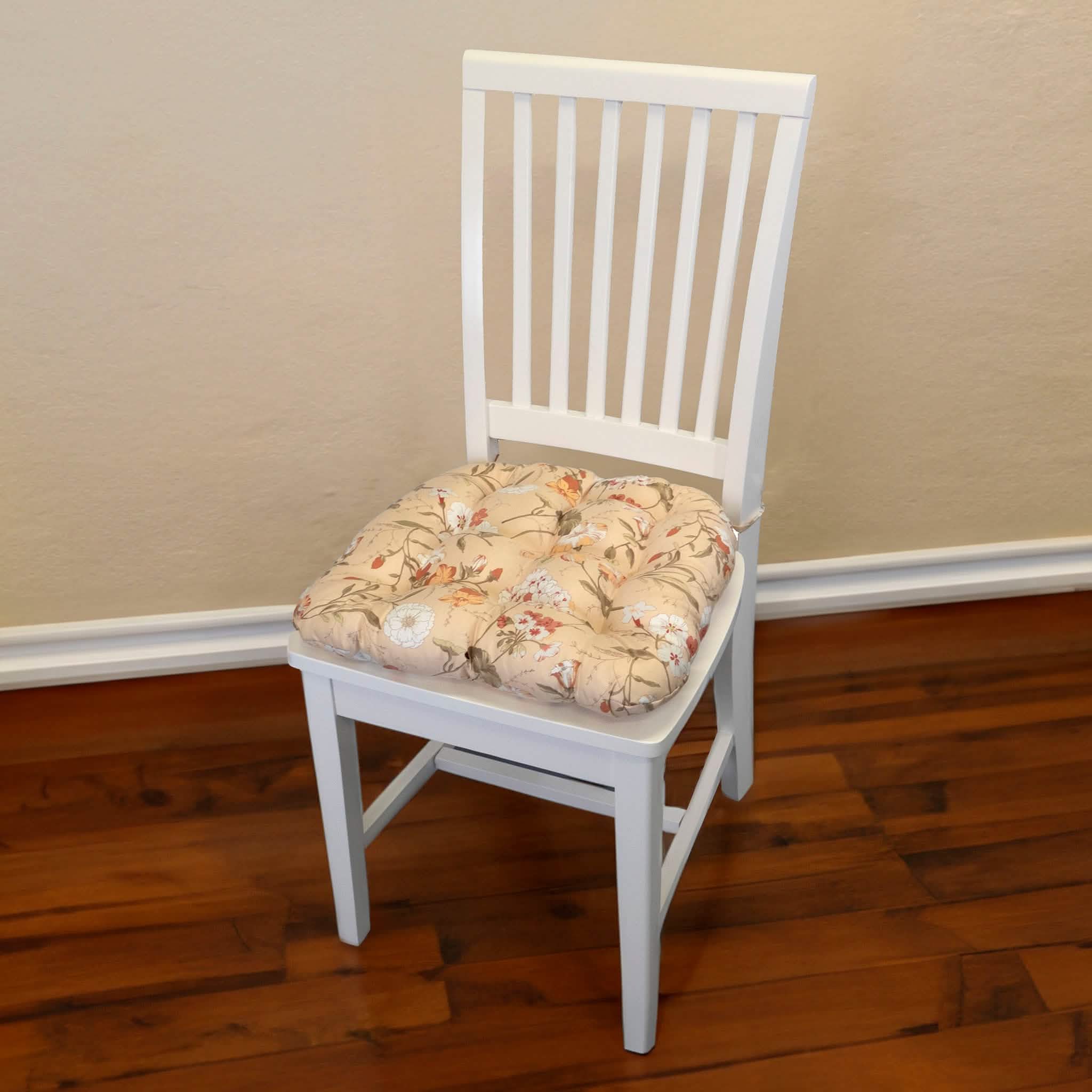 Close-up view of mimosa floral pattern dining chair cushion showing fabric texture and tie details