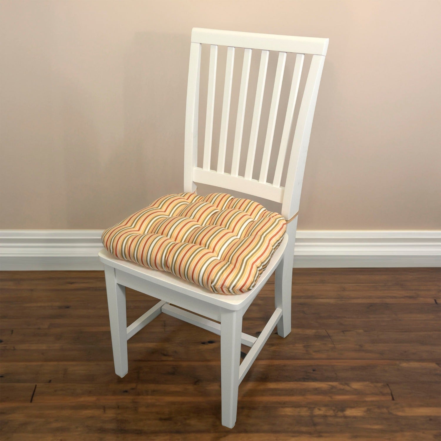 yellow striped dining chair cushion on a white dining room chair