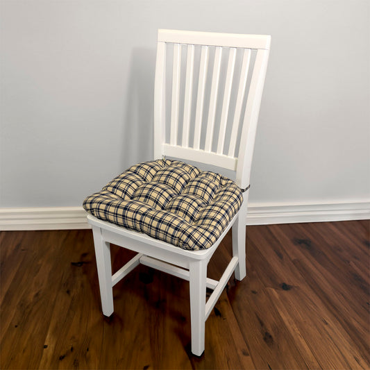 blue plaid dining chair pad with ties on white dining chair in traditional dining room