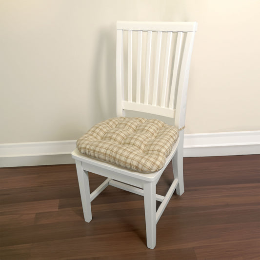 beige tan plaid dining chair cushion on a white dining room chair