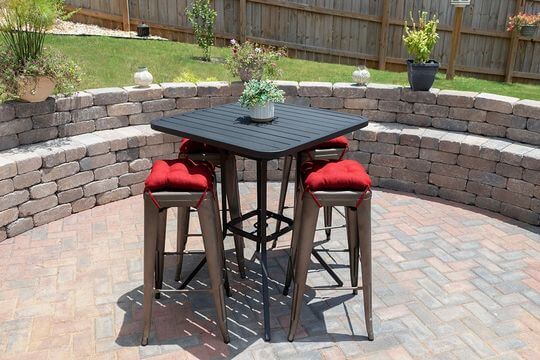 red cushions on square bar stools outside on the patio