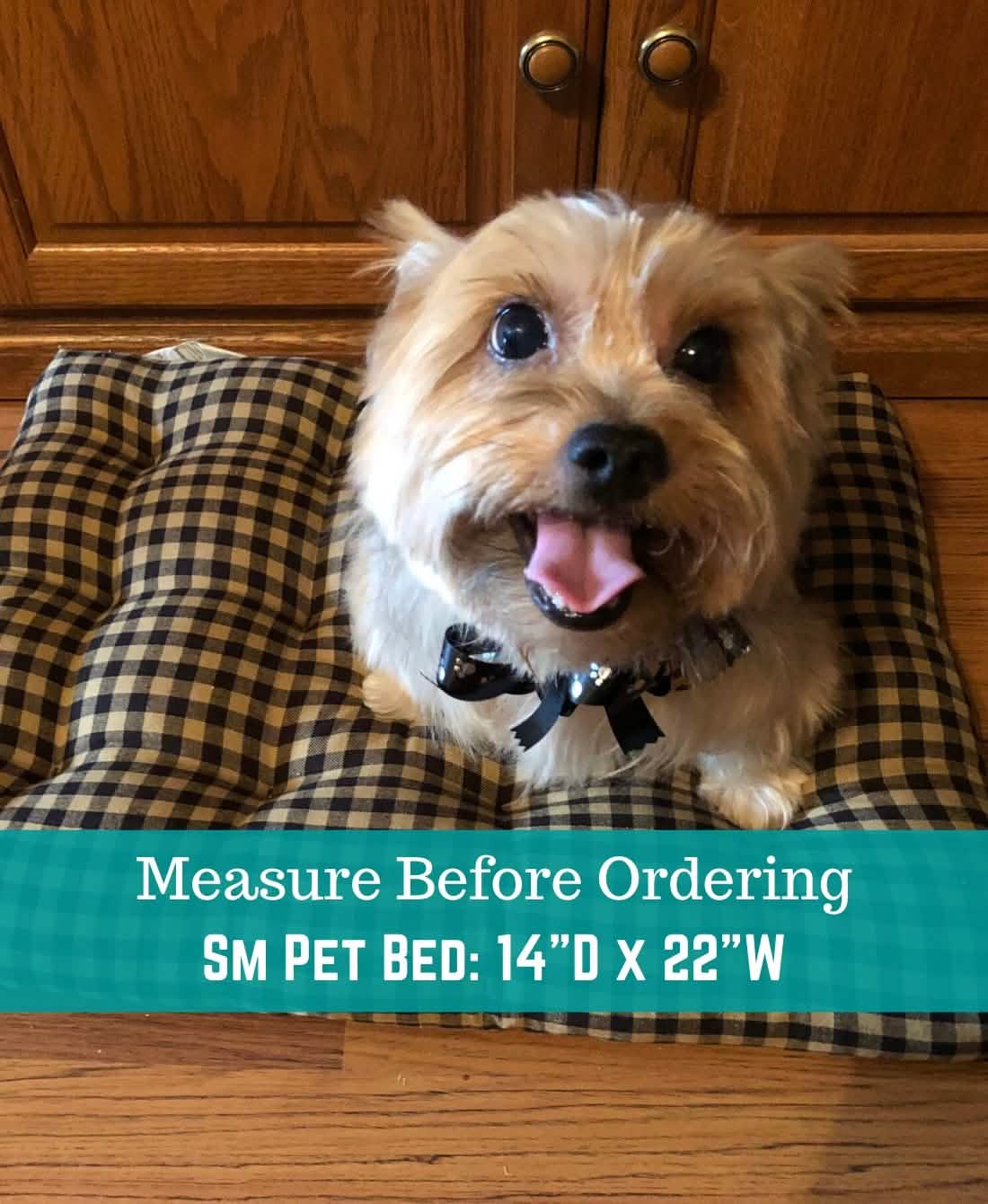 Black and cream checkered pet bed with deep tufted cushion