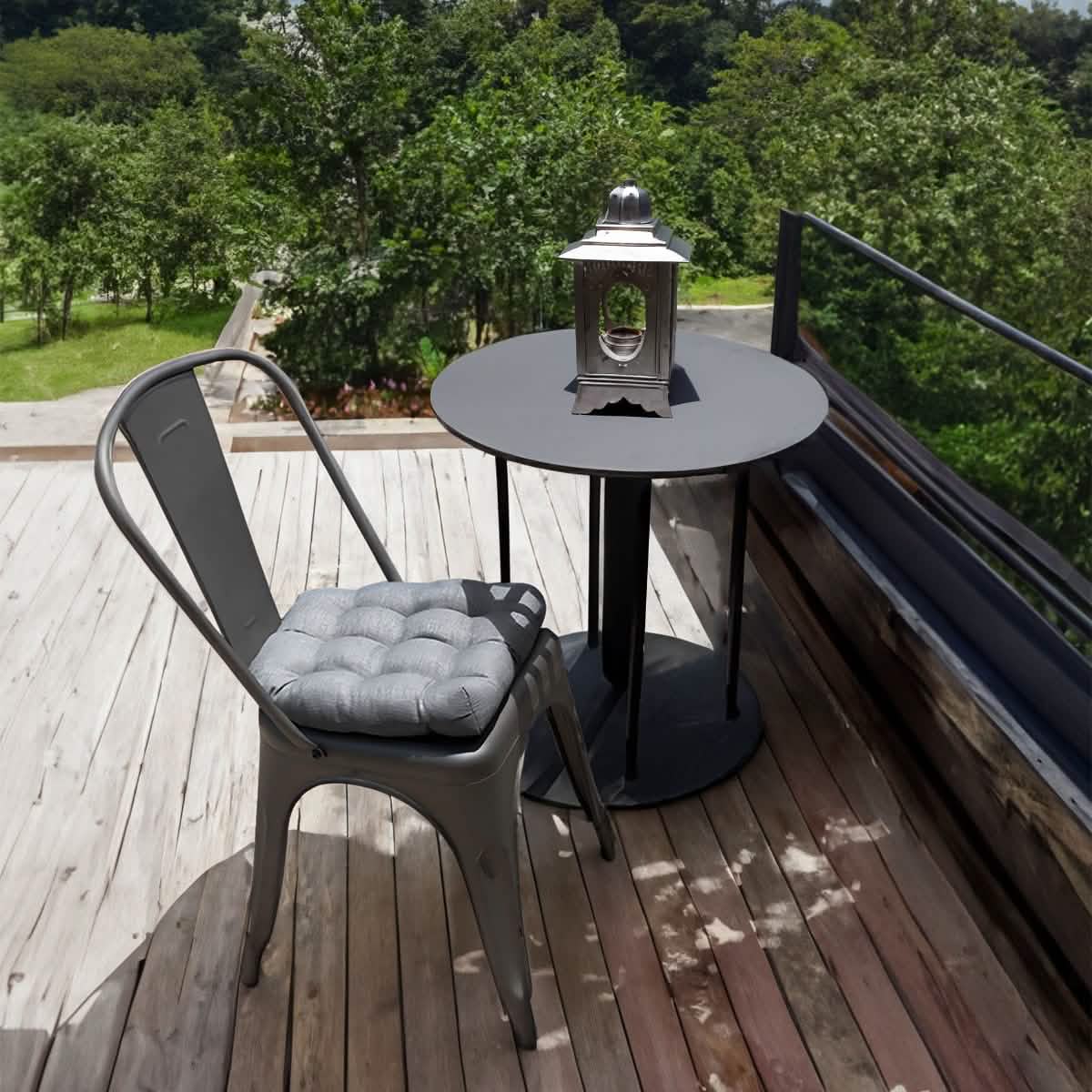 gray cushion on a metal tolix chair outdoor on the porch